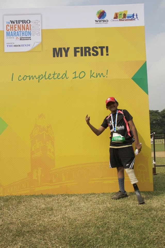 DakshinRehab patient with a running-blade prosthesis at a Chennai marathon 10K finish, Hyderabad