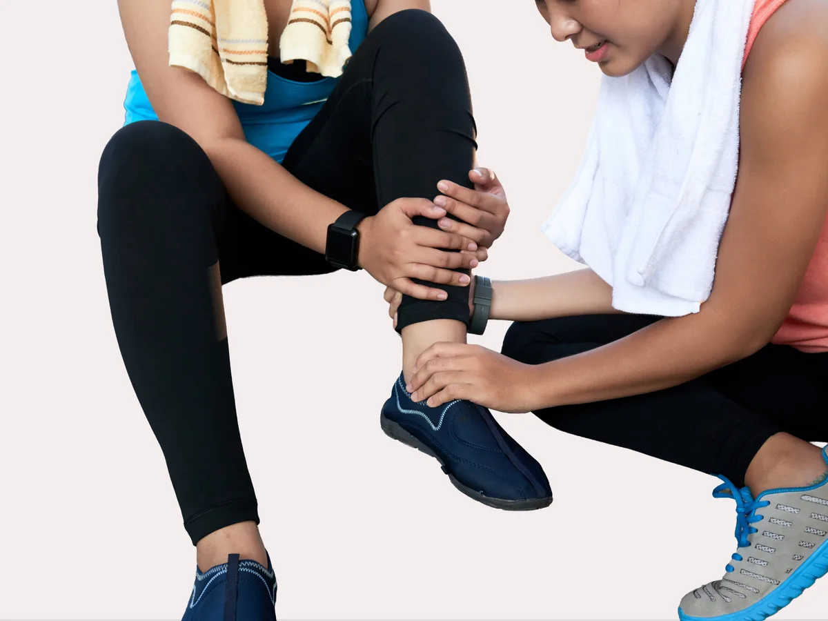 Patient gripping the back of ankle in pain