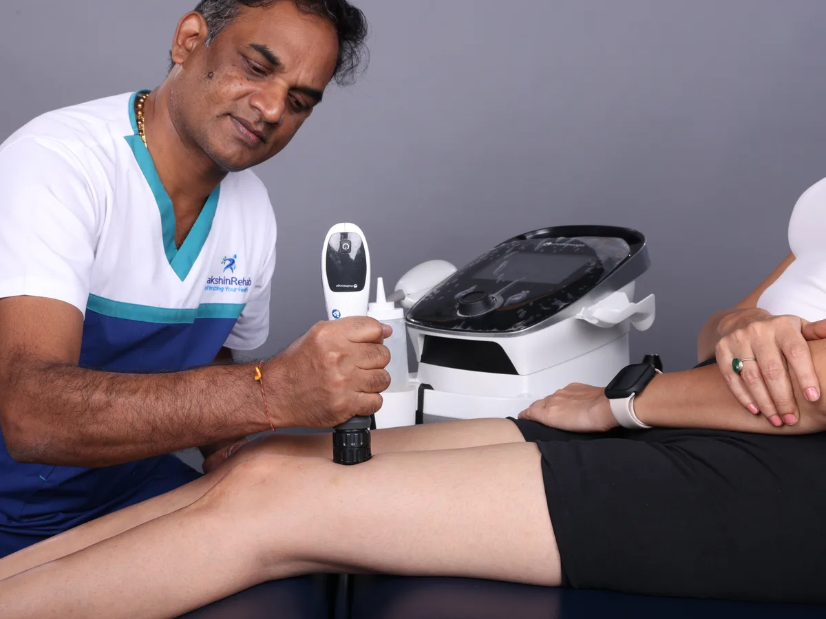 Shockwave therapy applied above the kneecap to break down friction adhesions at DakshinRehab, Moosapet