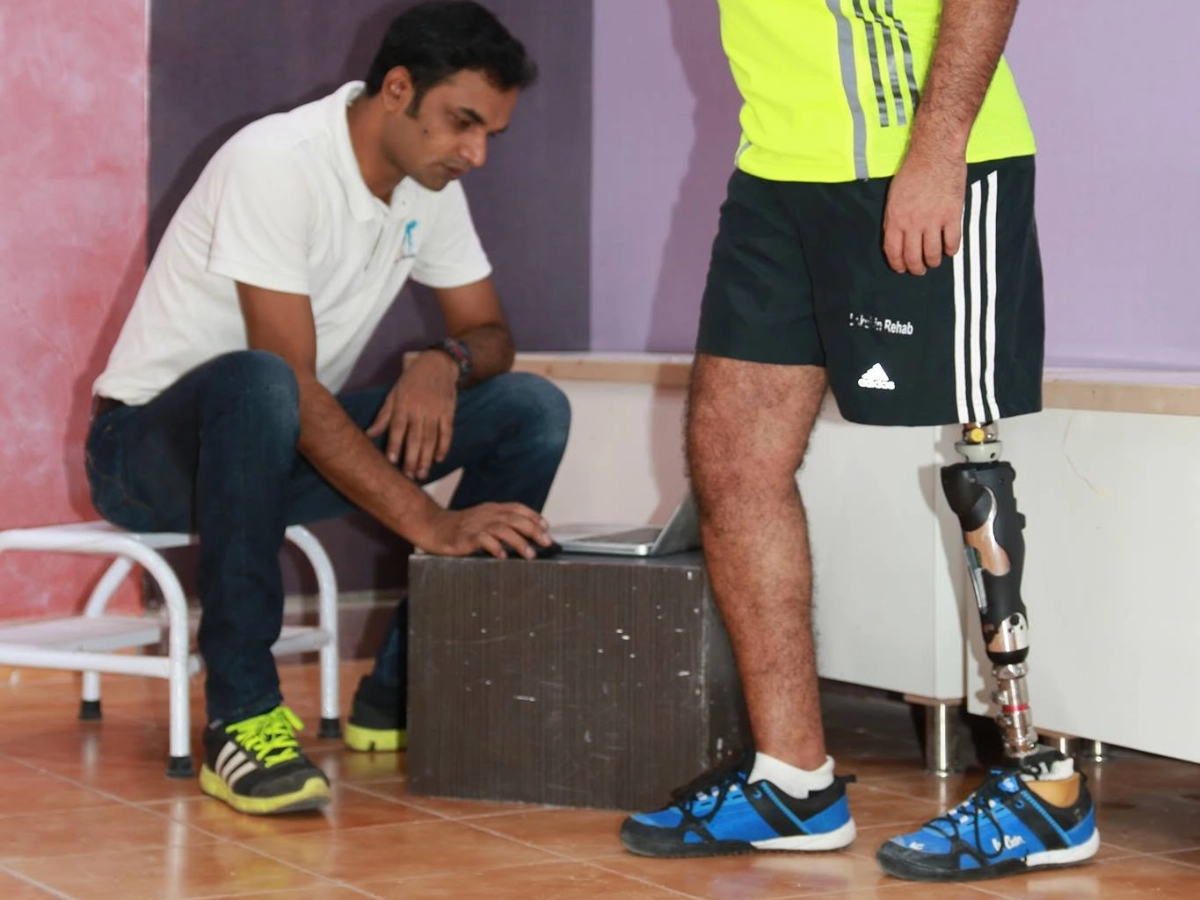 Patient with a hip-disarticulation prosthesis during gait assessment with a prosthetist at DakshinRehab Moosapet