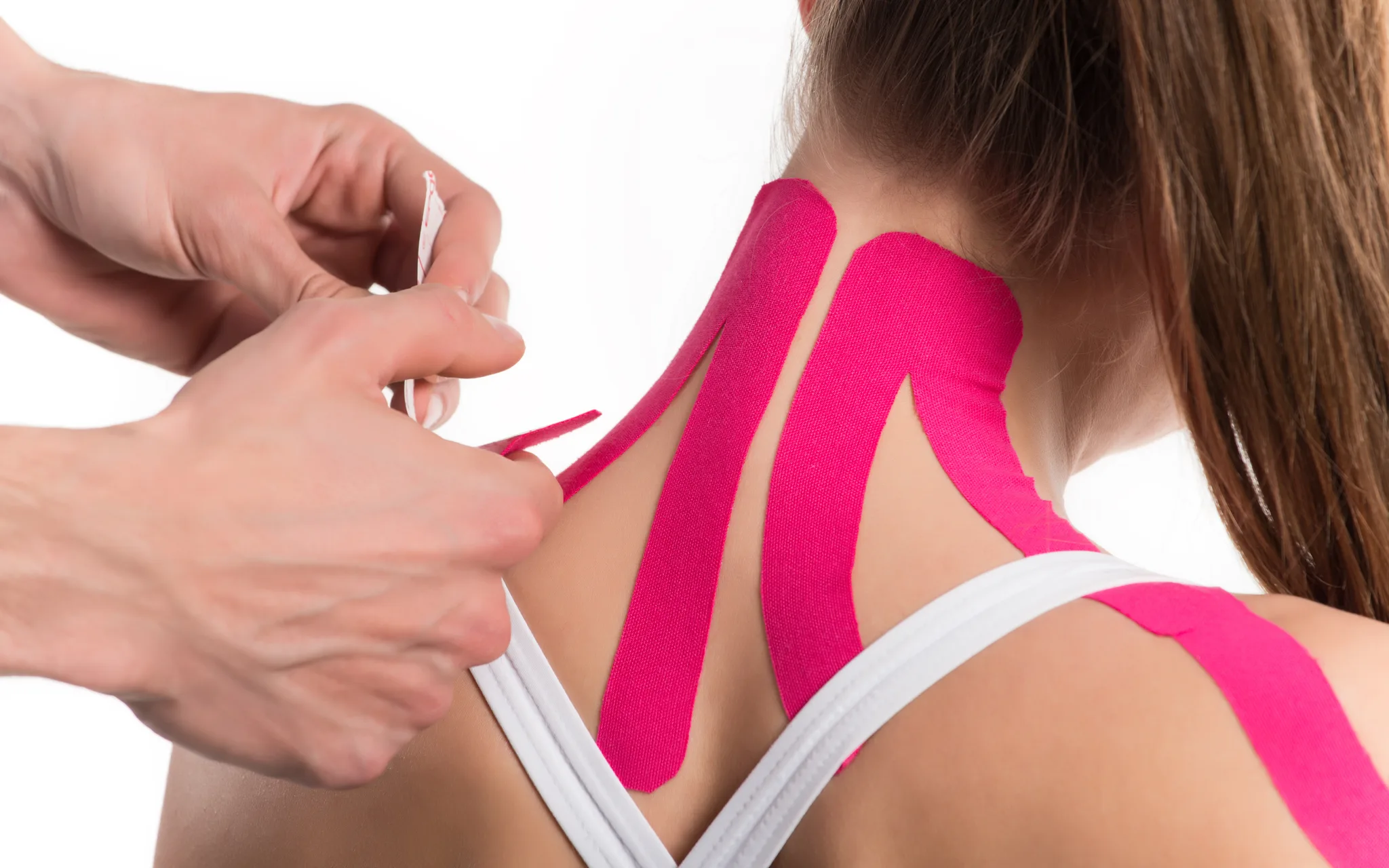 MPT-certified physiotherapist applying kinesio tape during a treatment session at DakshinRehab Moosapet, Hyderabad
