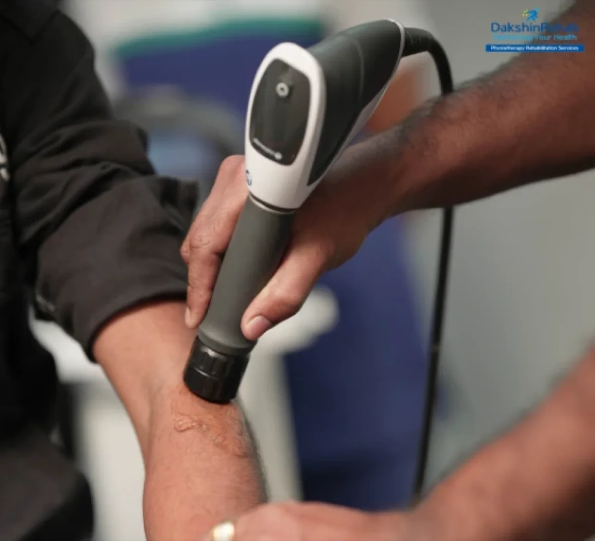 Patient gripping aching elbow experiencing tennis elbow symptoms